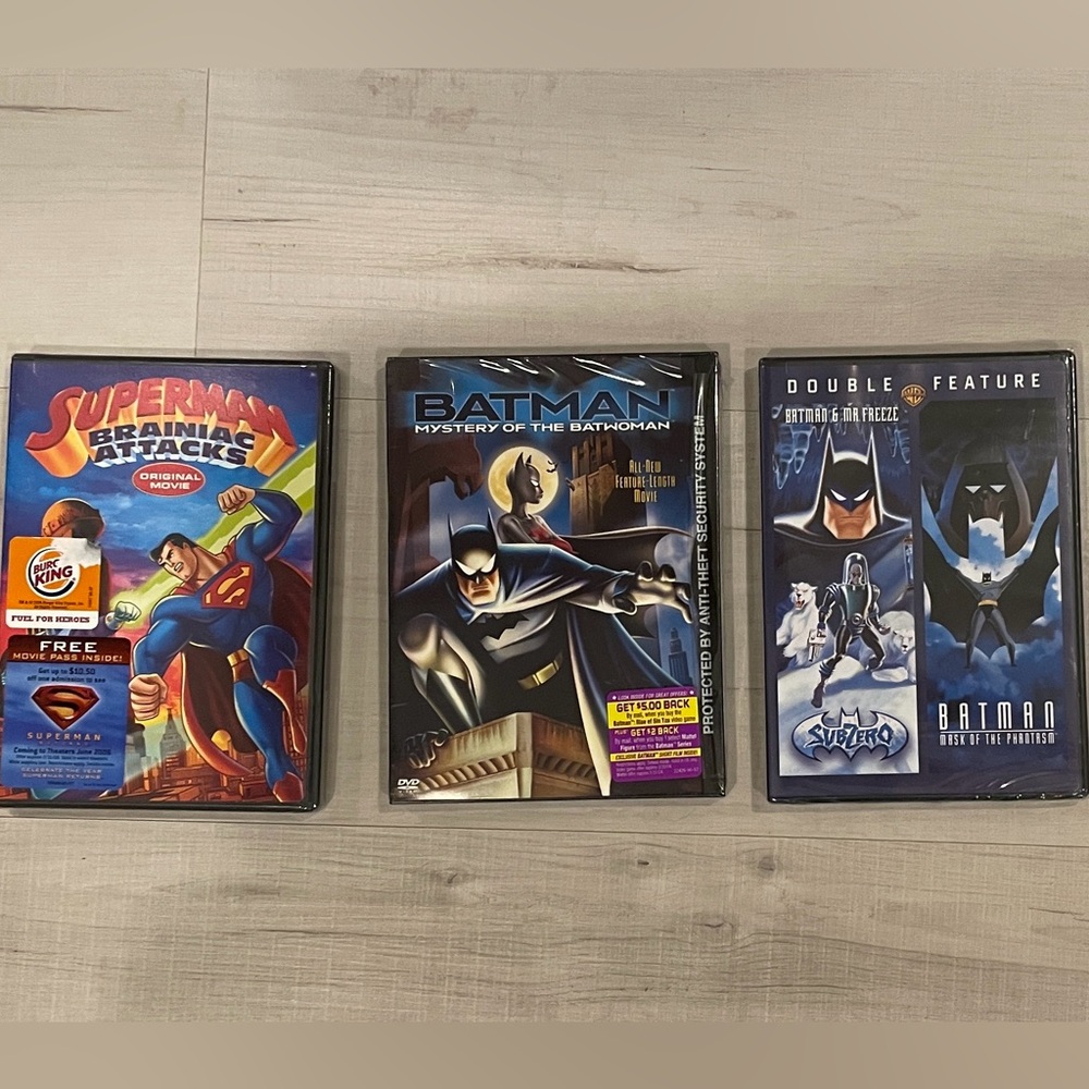 Super Hero cartoon movie DVDs. Superman and Batman Sealed in original packaging.